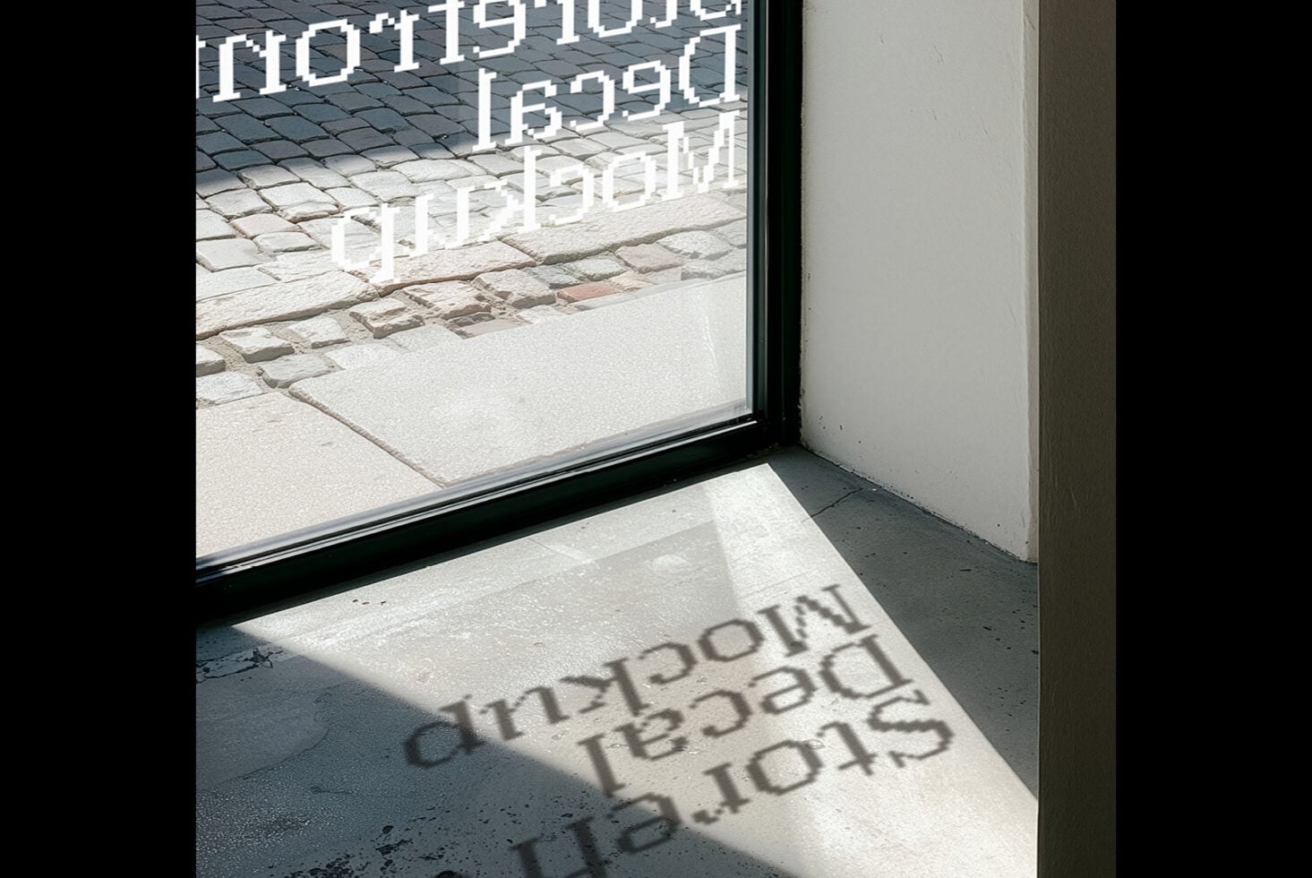 Storefront window with white neon signage casting shadows on concrete floor below