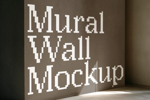 Pixelated white text on concrete wall reading "We are all working"