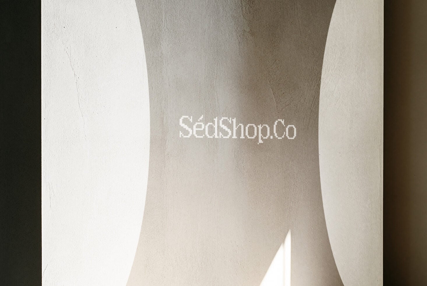 Concrete wall mockup with SédShop.Co logo embossed in white across textured surface