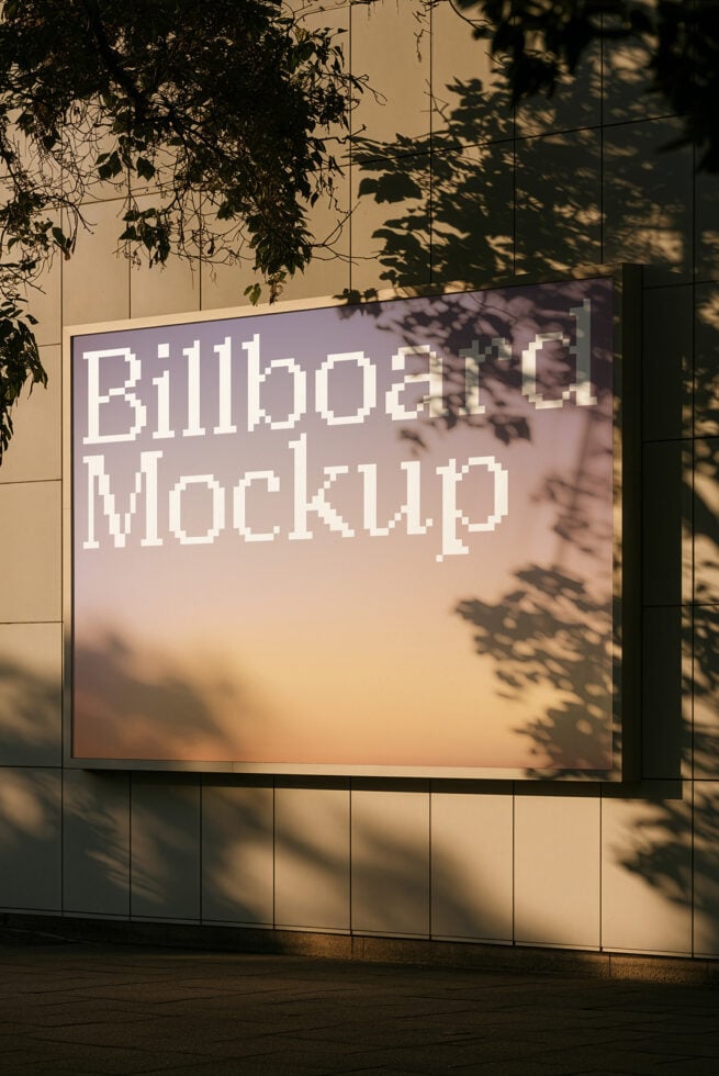 Billboard on modern concrete wall with tree shadows cast across it