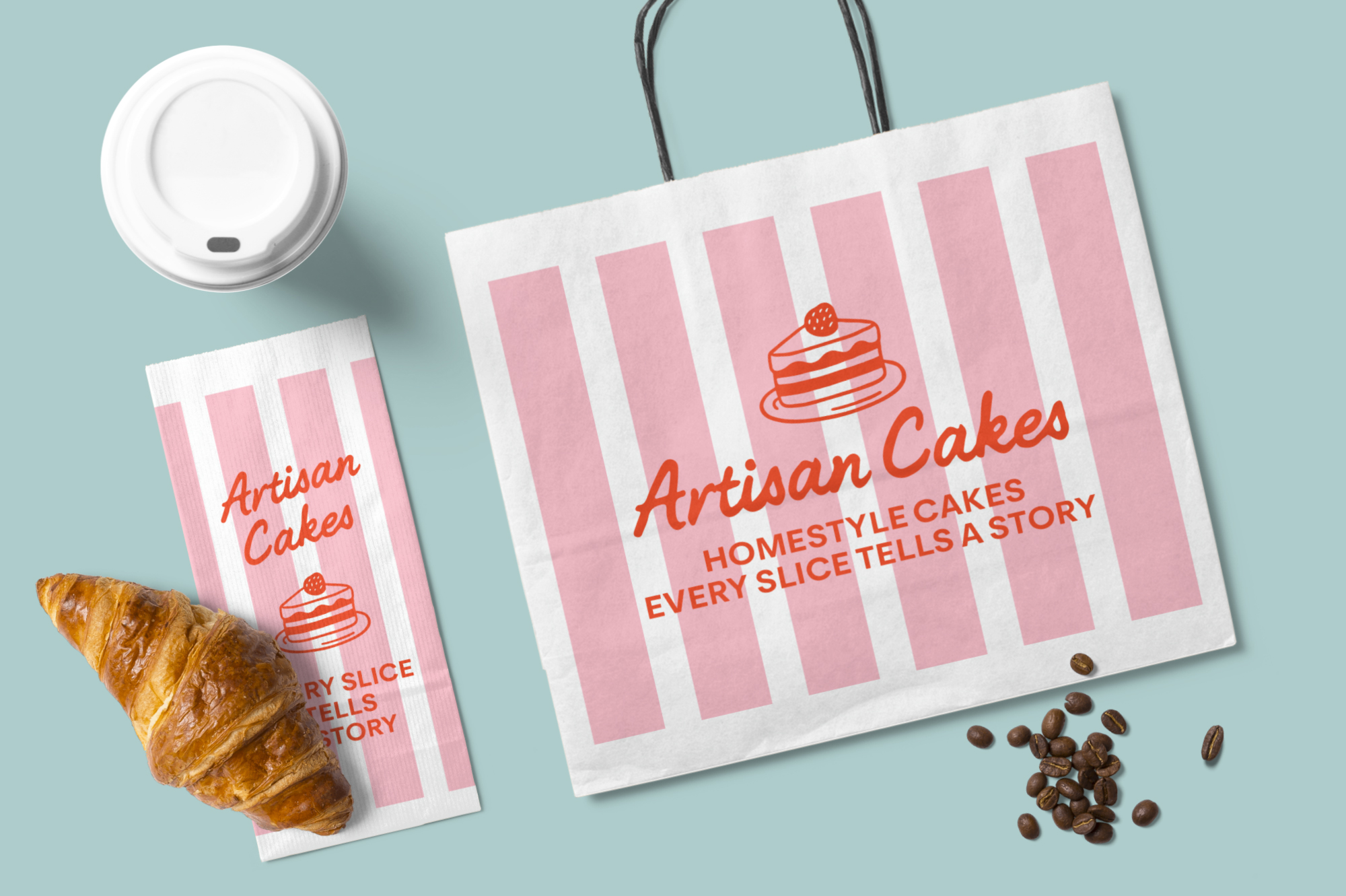 Bakery branding mockup with striped bags, coffee cup, croissant, coffee beans on blue surface