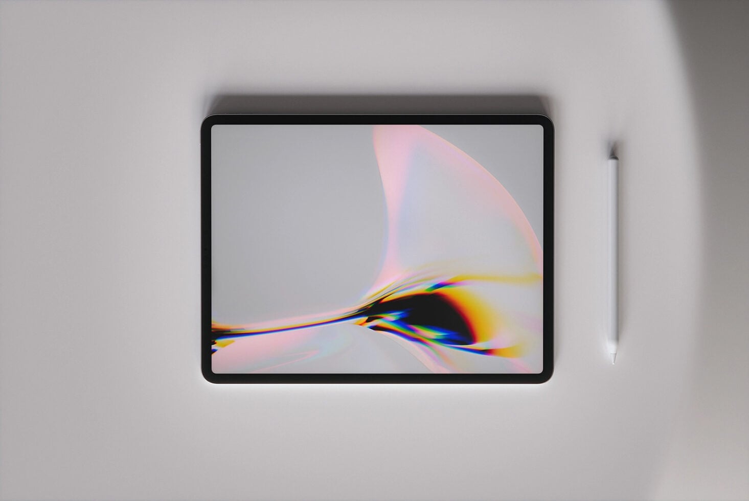 Tablet mockup with stylus showing abstract gradient artwork with pink, yellow, blue light refractions