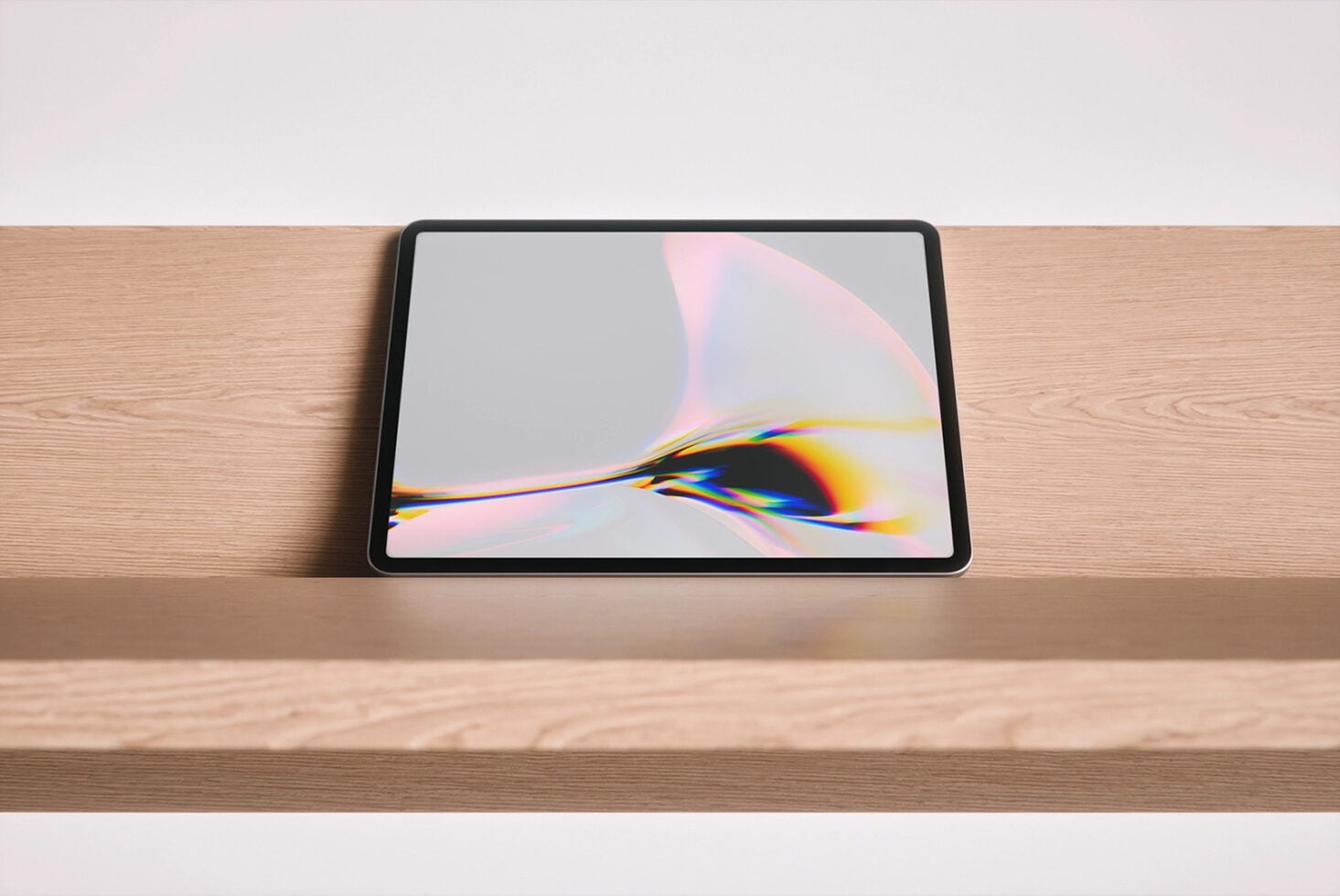 Tablet mockup on wooden desk with colorful light refraction artwork on screen