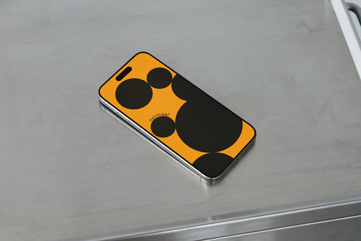 Bold yellow phone mockup with black circle design on gray surface