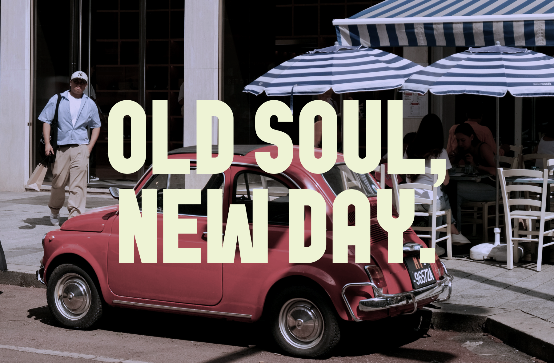 Retro European street scene with cream text overlay on burgundy Fiat 500, striped umbrellas, cafe