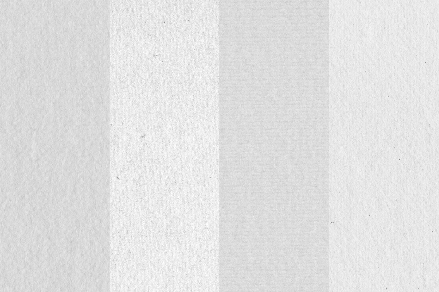 Folded white paper texture with soft shadows showing crease down middle
