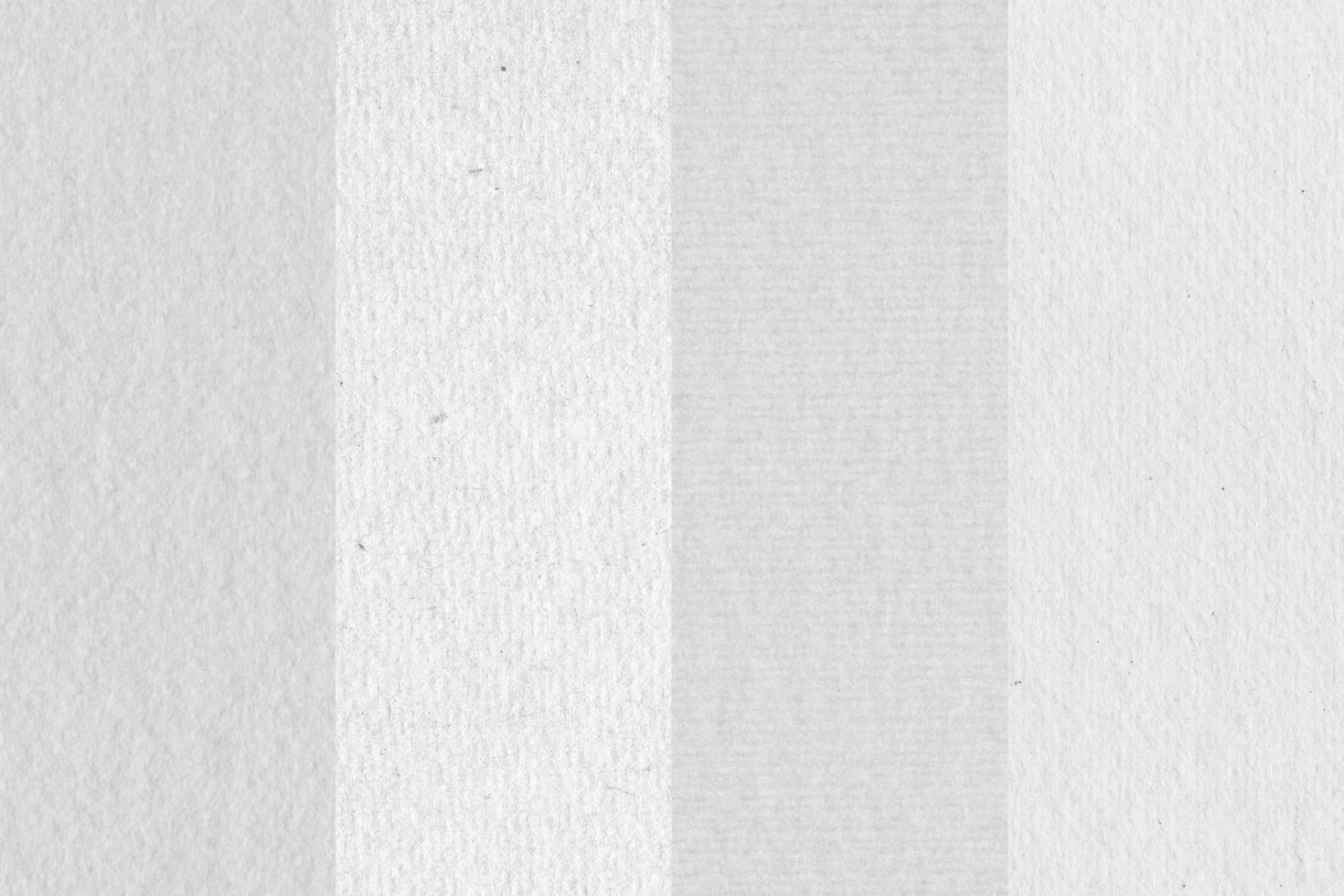 Folded white paper texture with soft shadows showing crease down middle