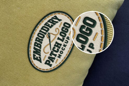 Embroidered patch mockup on fabric with close-up detail showing stitched text, gold trim