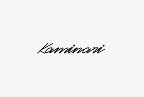 Kammarni italic script font with diagonal hatching effect on light background