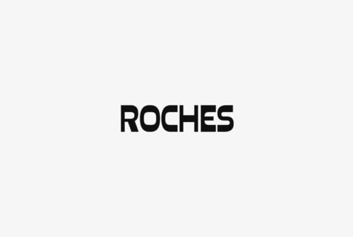 Minimalist mockup showing ROCHES text in bold black sans serif on light gray background
