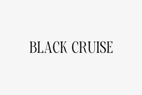 Black Cruise serif font in elegant spaced letters on minimal cream background