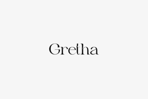 Gretha serif font displayed in black on minimal light gray background