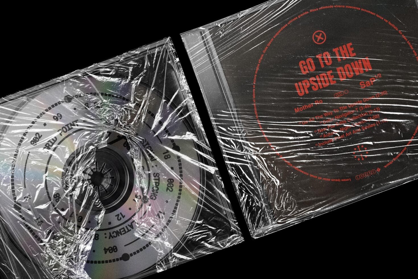 CD case mockup wrapped in plastic with distressed red text reading "Go to the Upside Down" on dark cover