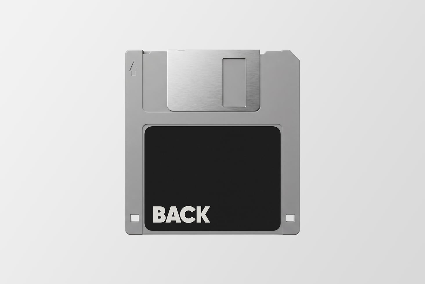 Retro floppy disk mockup with silver casing, black label showing back side view