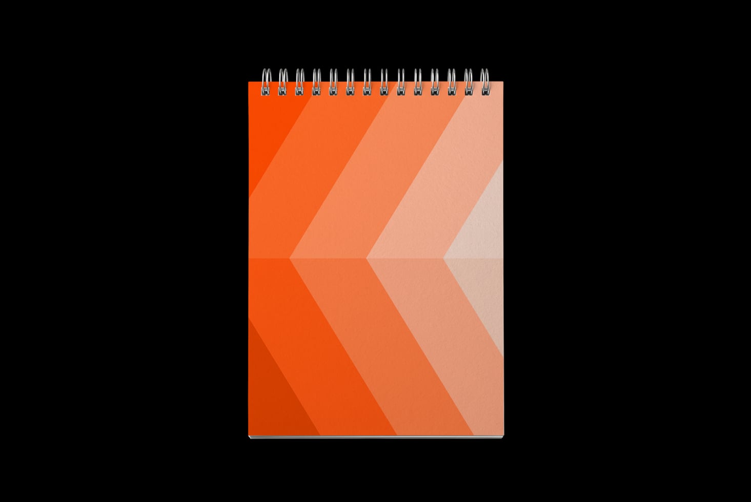 Spiral notebook mockup with gradient orange chevron pattern on cover