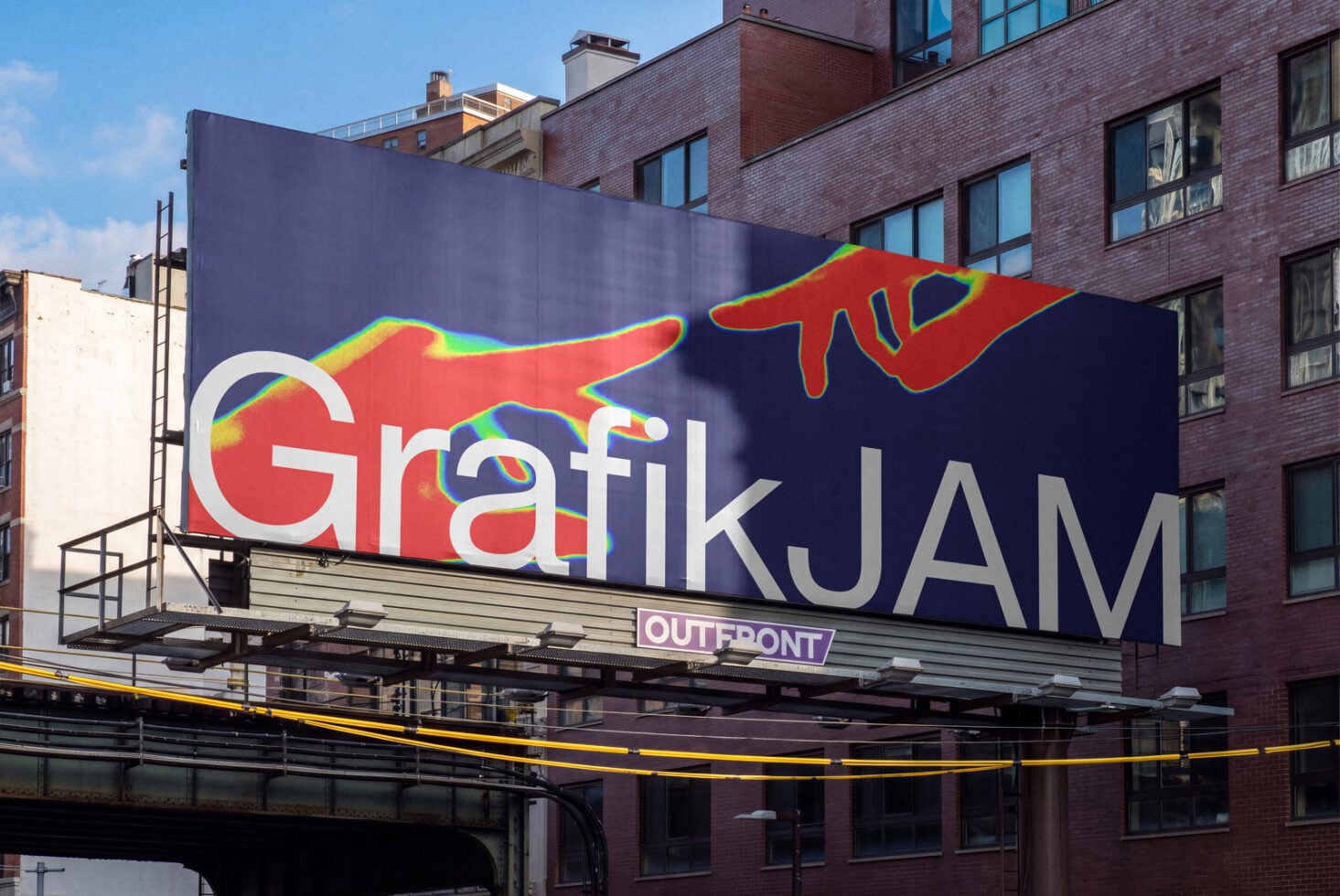 Colorful street art billboard with "Grafik JAM" text, red hand graphic, neon rainbow accents on urban building