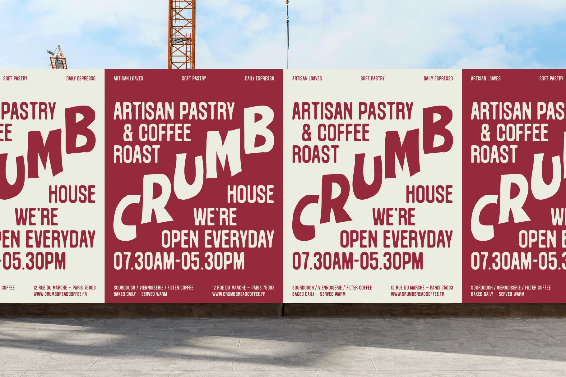 Crumb Bread Coffee shop posters on construction site wall with burgundy, cream color scheme