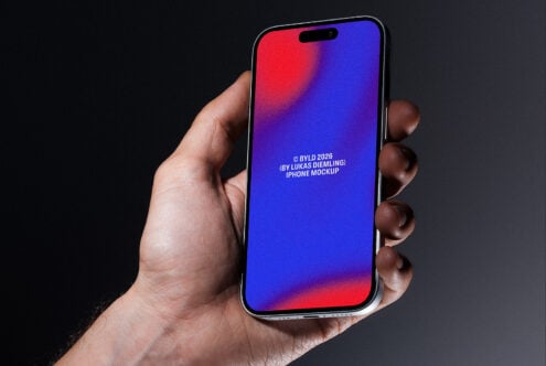 Hand holding iPhone with vibrant red to blue gradient background on screen