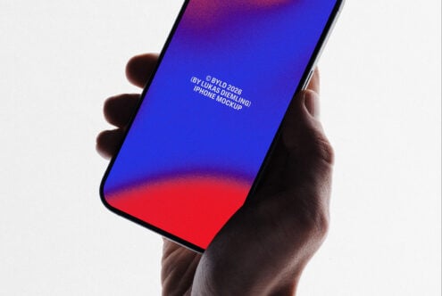 Hand holding iPhone with vibrant blue to red gradient screen mockup