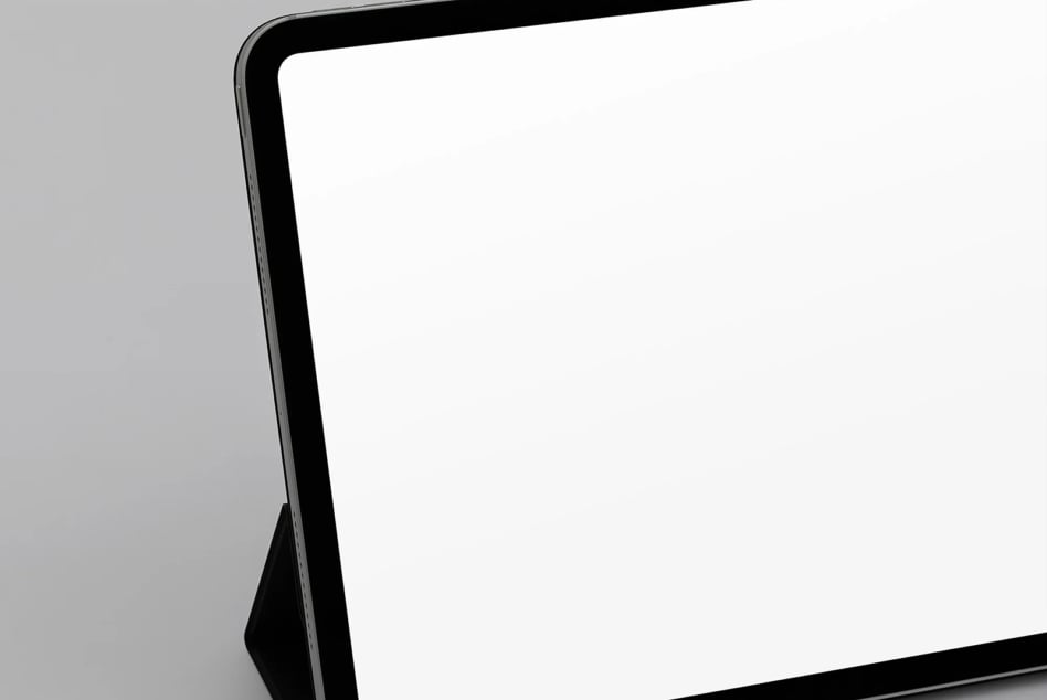 Sleek tablet mockup with black frame on gray background, angled view showing blank screen