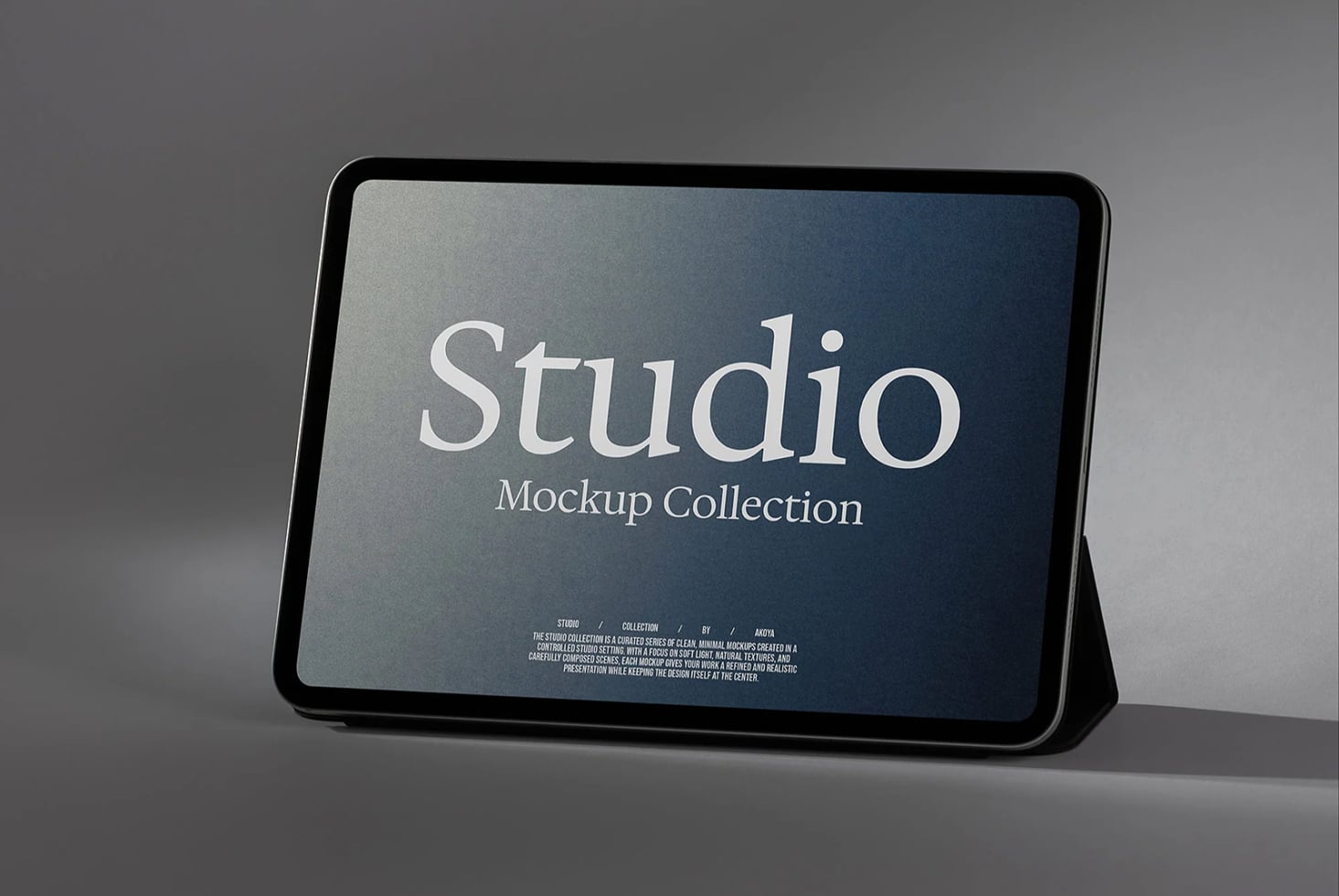Tablet mockup displaying Studio branding with elegant serif typography on a blue gradient background
