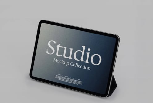 Tablet mockup showing Studio branding on dark blue screen with stand propped up