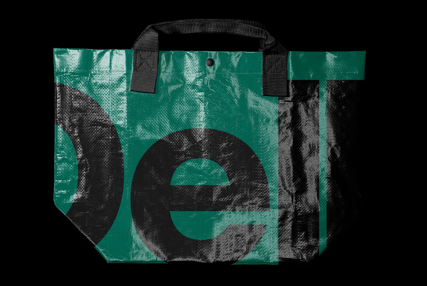 Teal woven tote bag mockup with oversized black letters, textured fabric surface, black handles