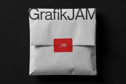 White envelope mockup with GrafikJAM branding plus red seal label on dark background