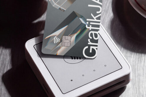 Credit card mockup on phone screen with holographic prism light effects, wireless chip icon visible