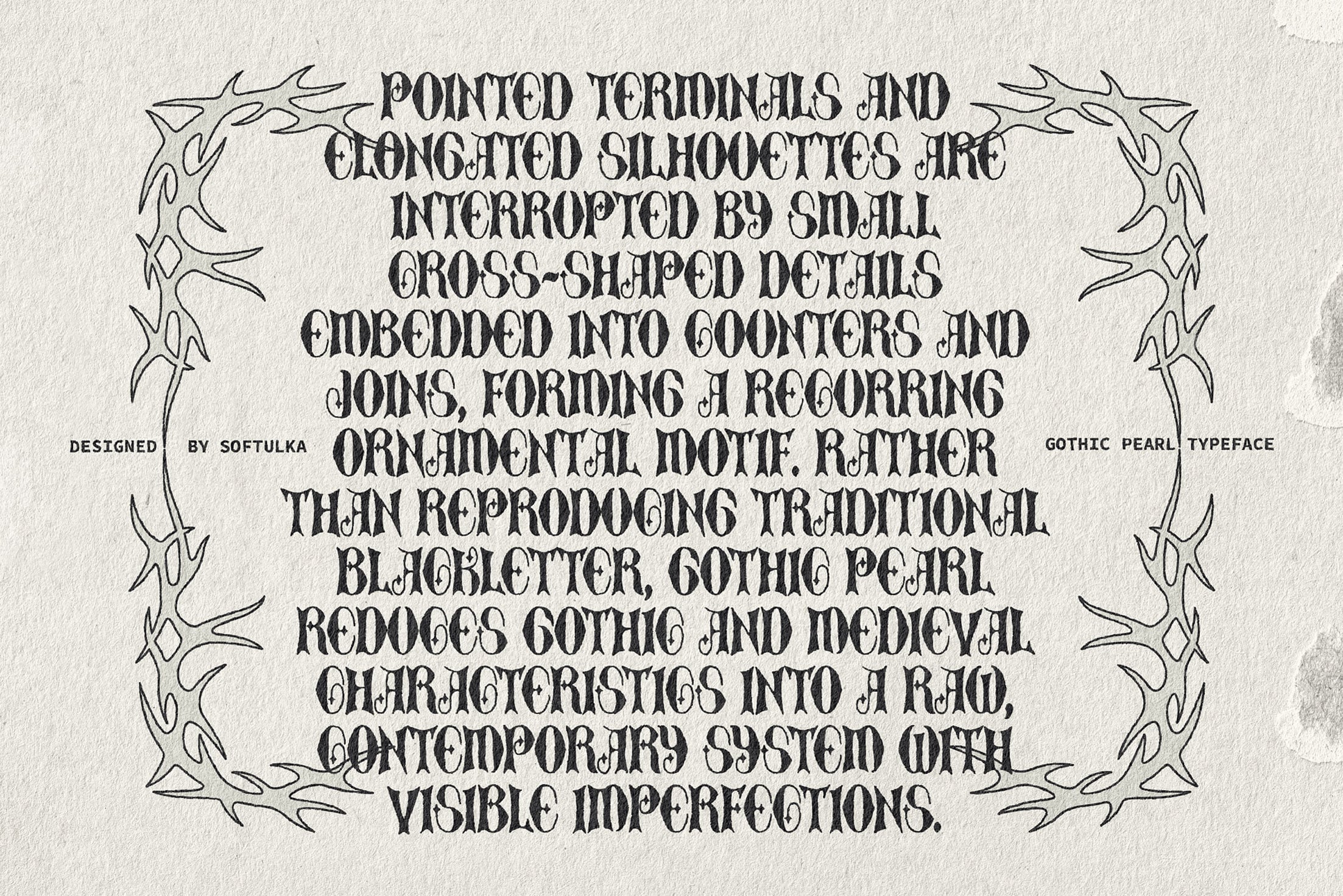 Gothic Pearl typeface specimen with ornamental branch border on textured paper