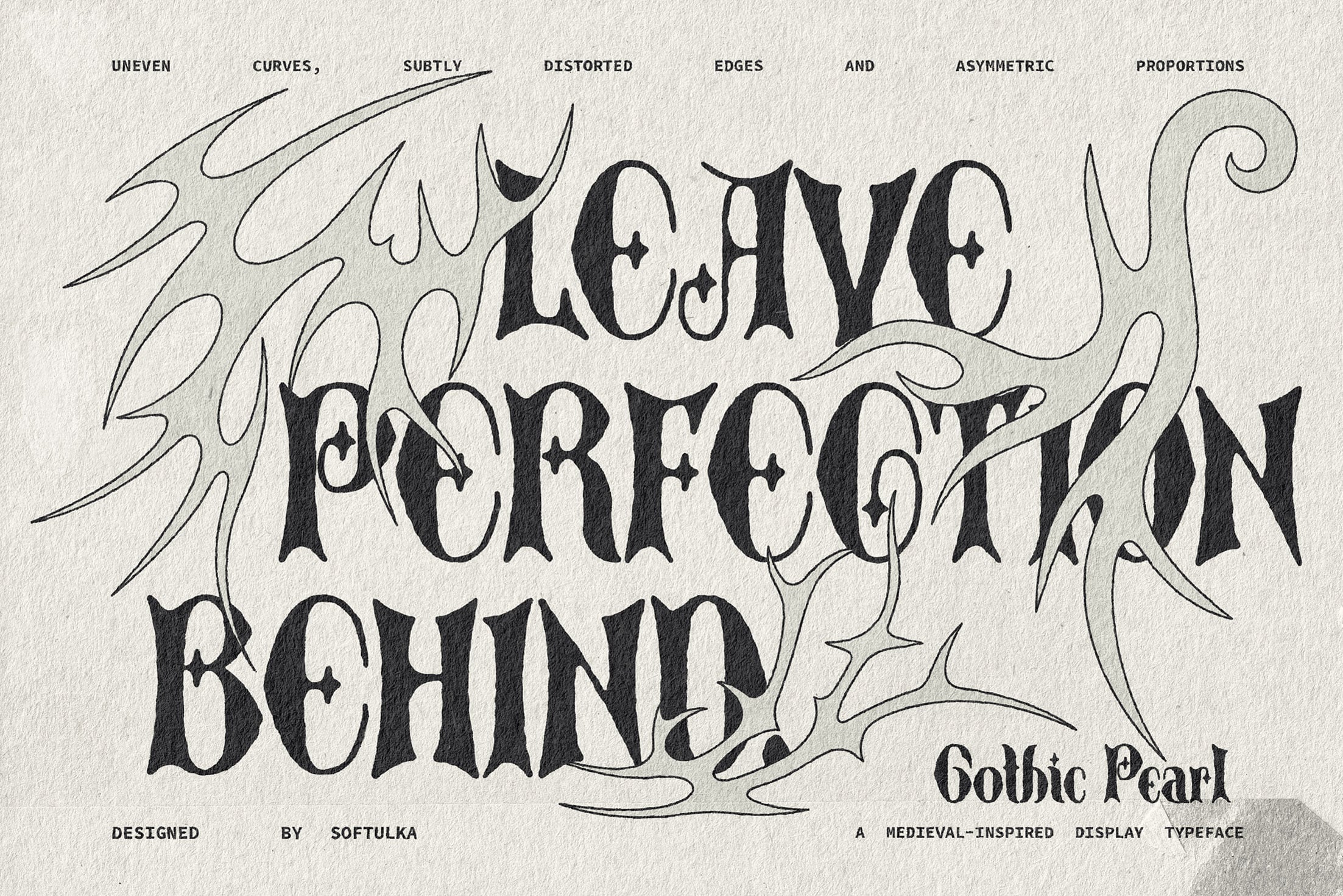 Gothic Pearl font with wobbly curves, wonky edges, medieval vibes on textured paper