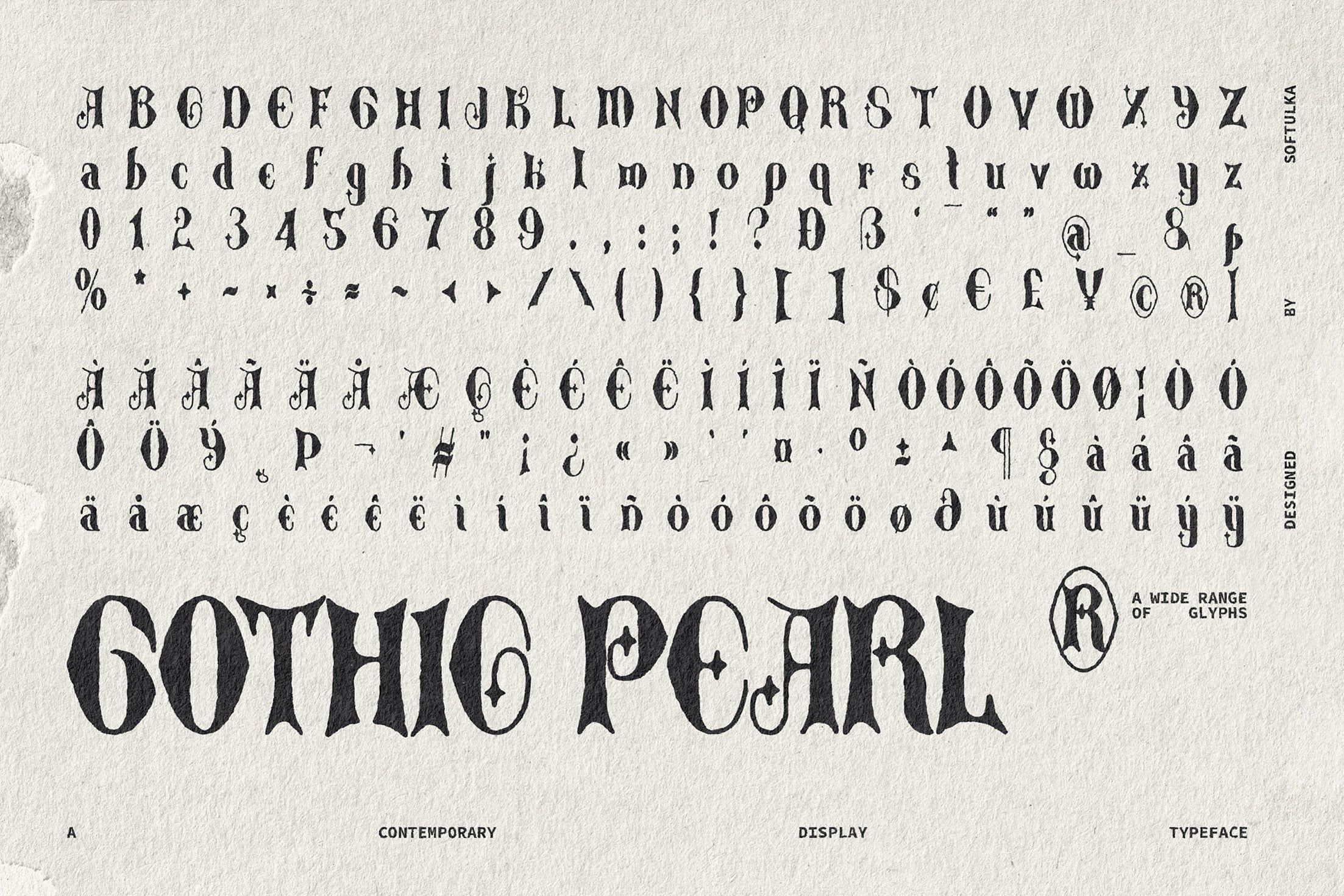Gothic Pearl typeface showing full character set with uppercase, lowercase, numbers, symbols, accents on textured paper