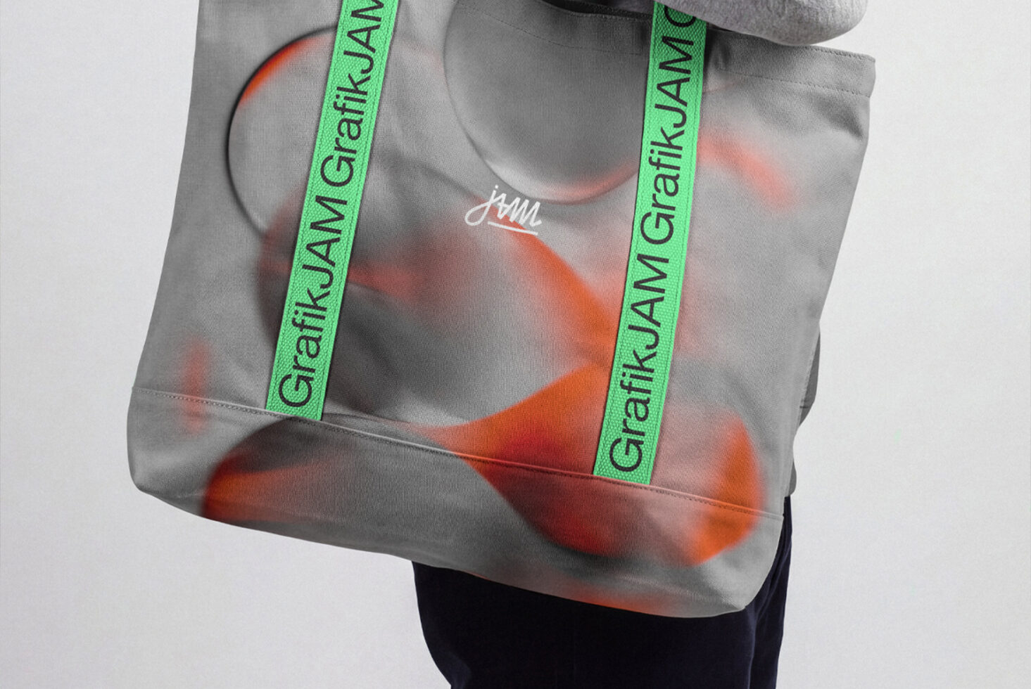 Gray tote bag with neon green straps, orange abstract print, custom branding mockup
