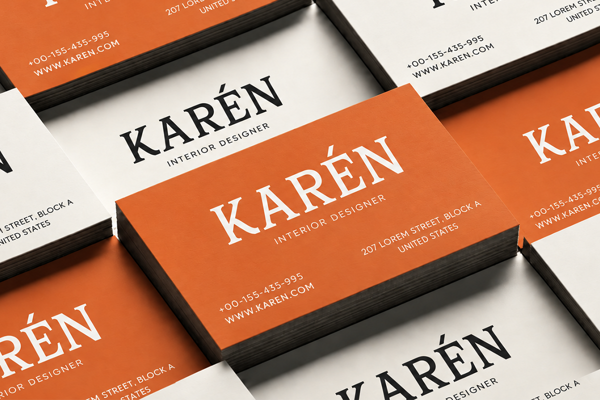 Business card mockup showing orange plus white cards with Karen interior designer branding in black frames