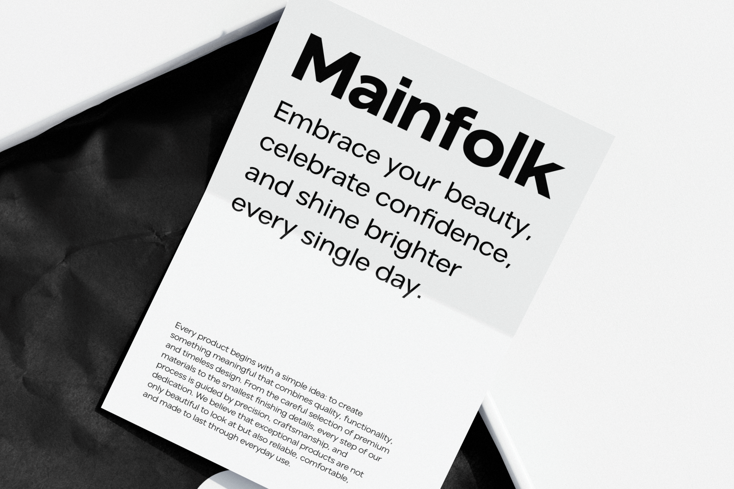 Mainfolk brand mockup with minimalist black geometric shapes on white paper showing typography layout
