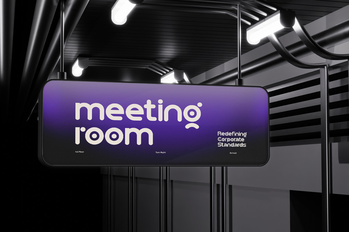 Glowing purple wayfinding sign in modern office corridor with industrial ceiling lights