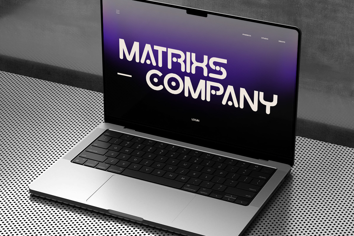 Laptop mockup showing bold purple gradient website design with Matrix Company branding on screen