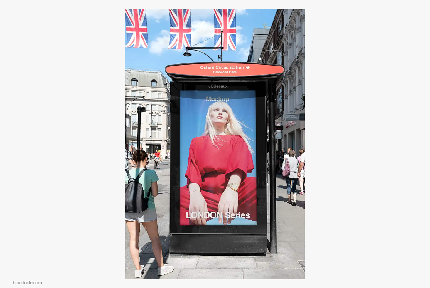 Bus shelter ad mockup at Oxford Circus Station with portrait photo of woman in red shirt on display screen