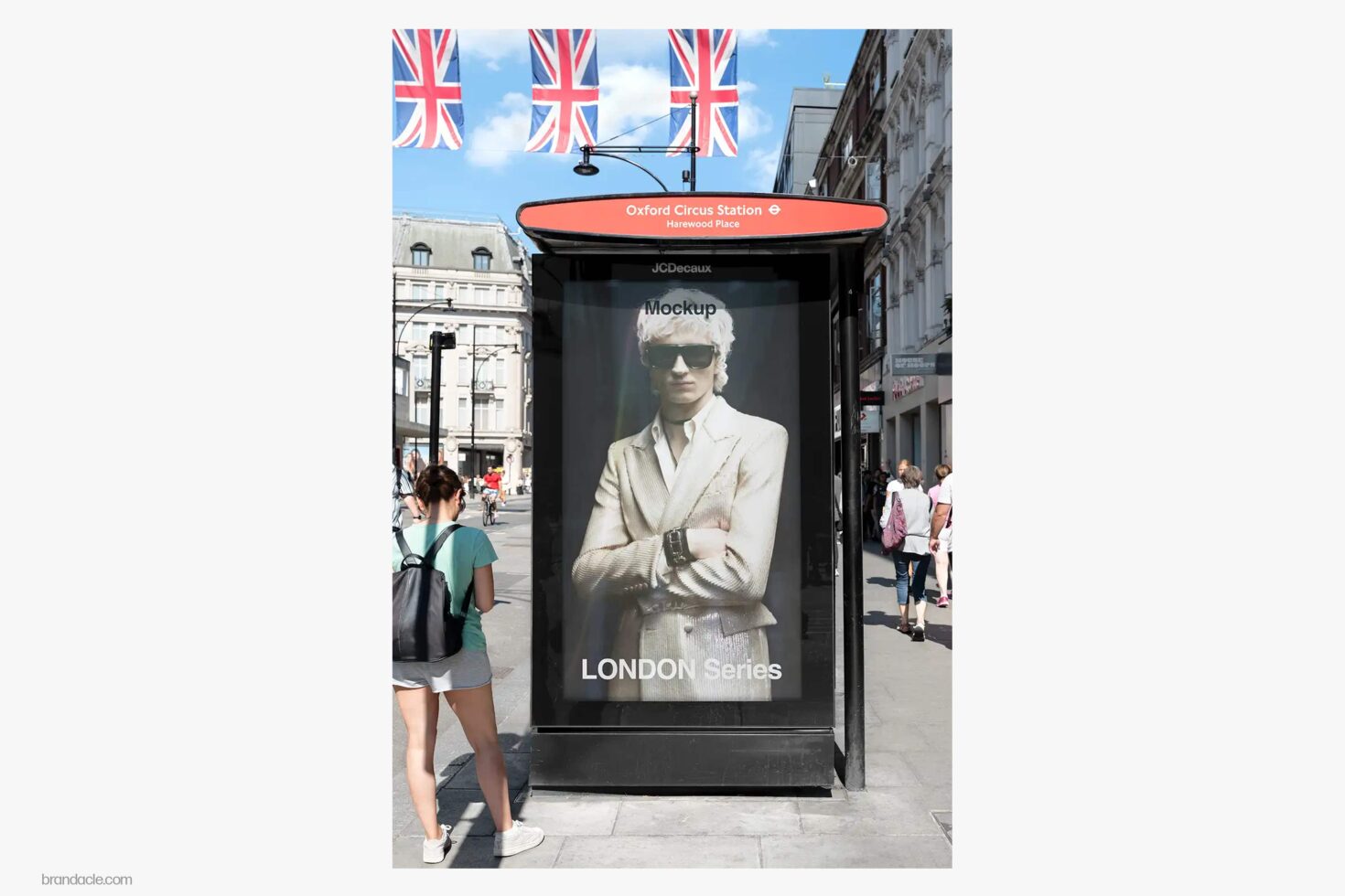 Bus shelter ad mockup at Oxford Circus Station with model in cream blazer, London street scene