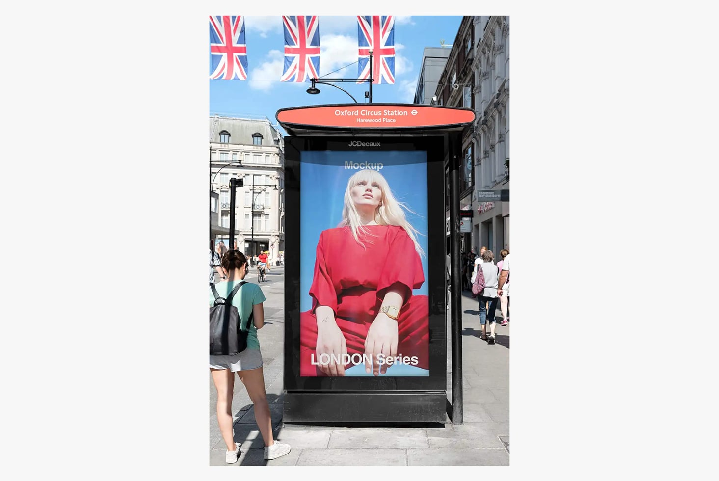 London bus shelter ad mockup at Oxford Circus Station with Union Jack flags overhead