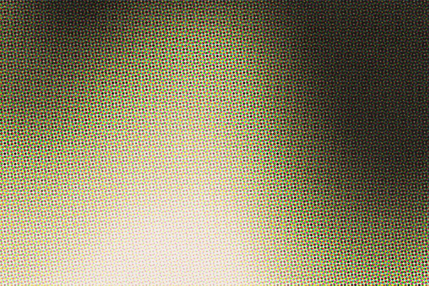 Halftone dot gradient fading from vibrant cmyk colors to white with retro print texture