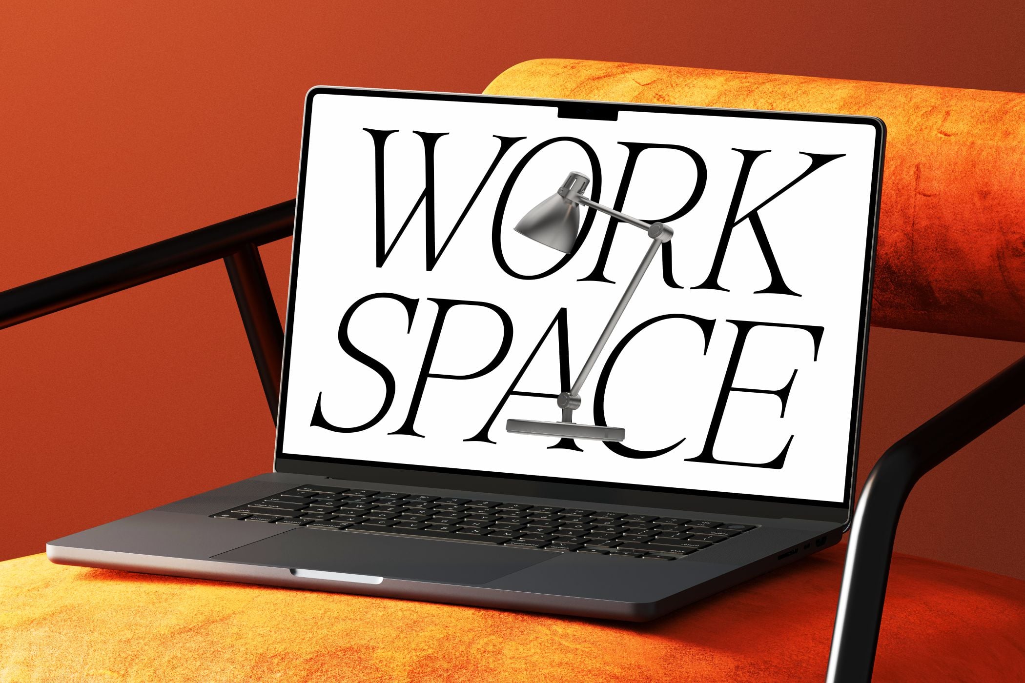 Laptop displaying "WORK SPACE" text with desk lamp on warm orange background