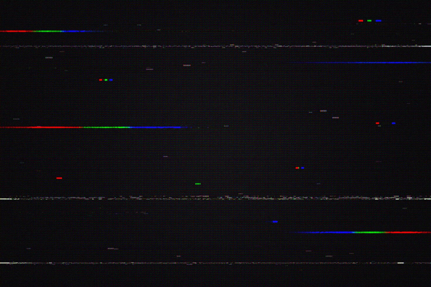 Glitchy RGB scan lines with red green blue pixels scattered across dark background