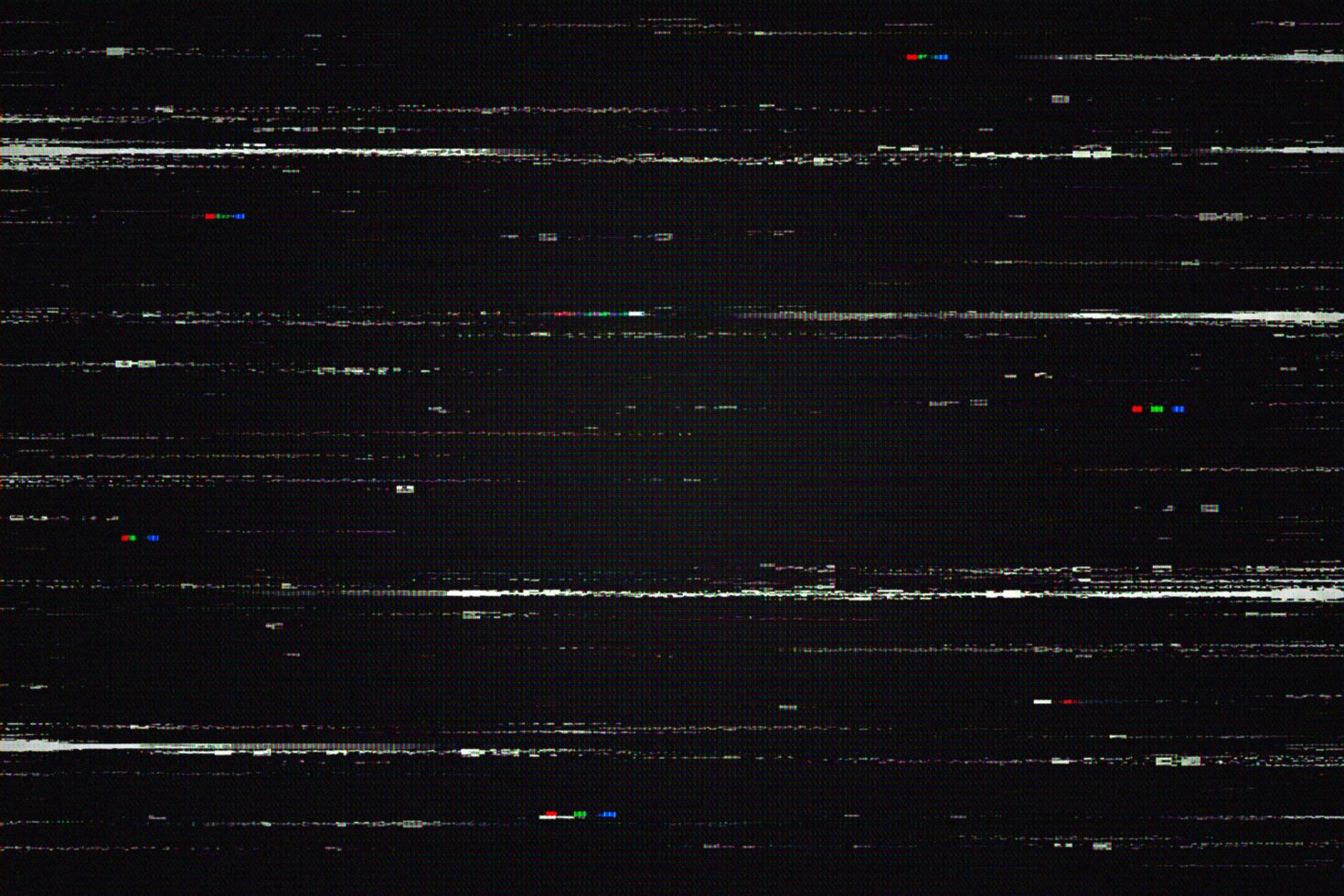 Glitchy VHS scan lines with chromatic aberration on dark background