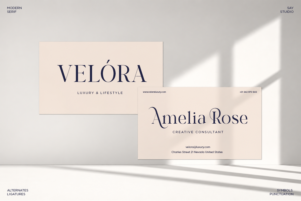 Velóra luxury brand business cards mockup with serif typeface on cream background with shadow overlay