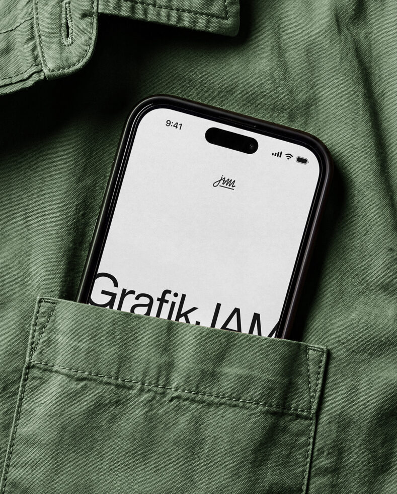 iPhone mockup in sage green jacket pocket with minimal screen display