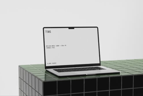 Laptop mockup on geometric tiled surface with editable screen display showing specs