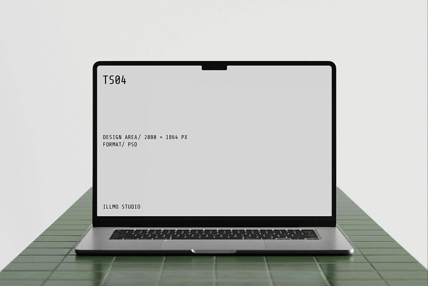 Laptop mockup on green tile surface with editable screen displaying specs