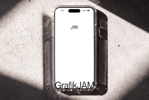 iPhone mockup with clean screen on concrete surface with dramatic shadows