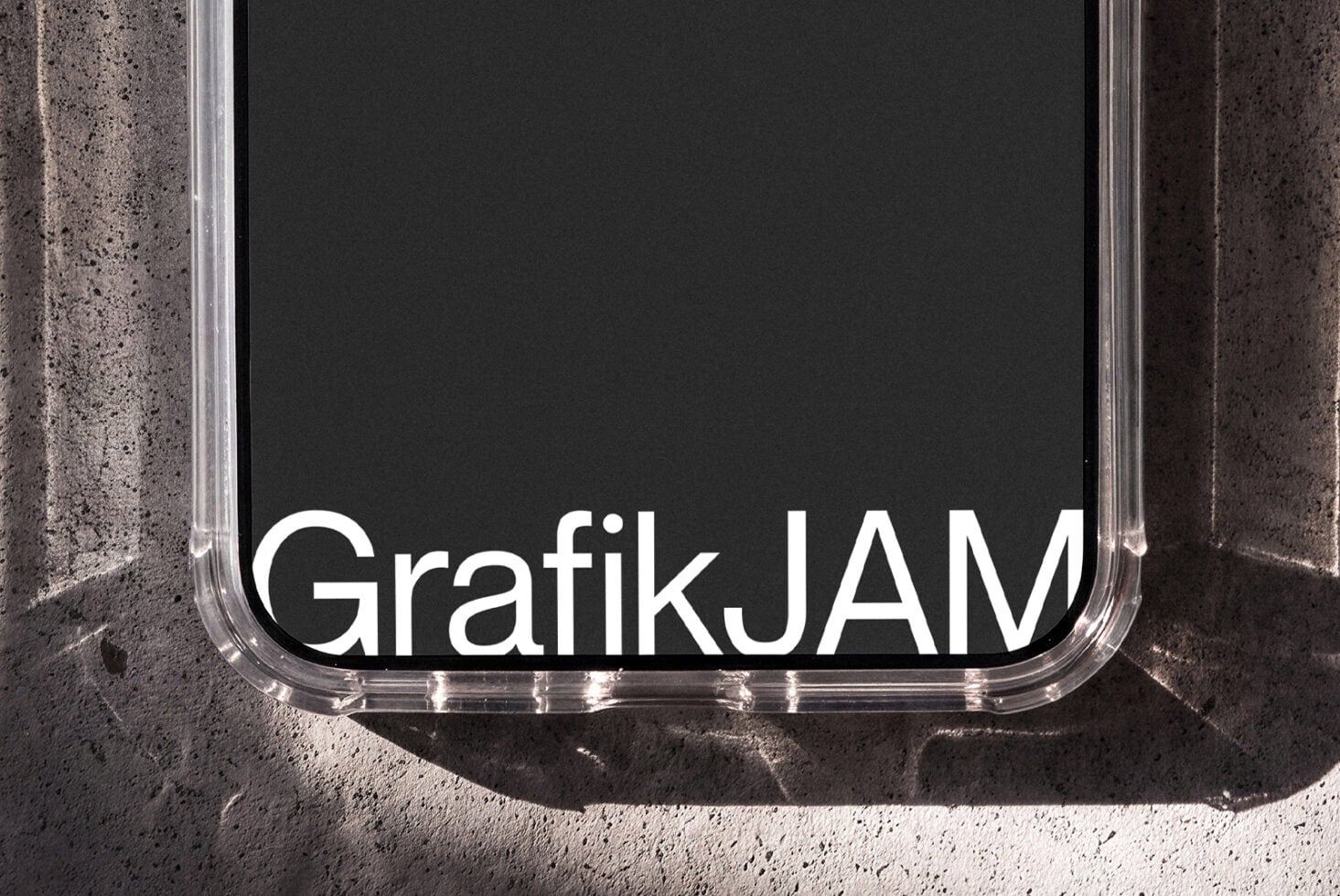 Clear phone case mockup with rounded edges on concrete surface showing branding space